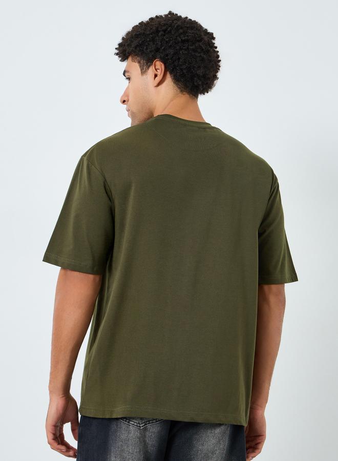 Styli Men Green Graphic Print Oversized T-Shirt - Image 3
